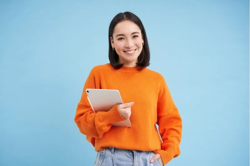 woman in orange sweater